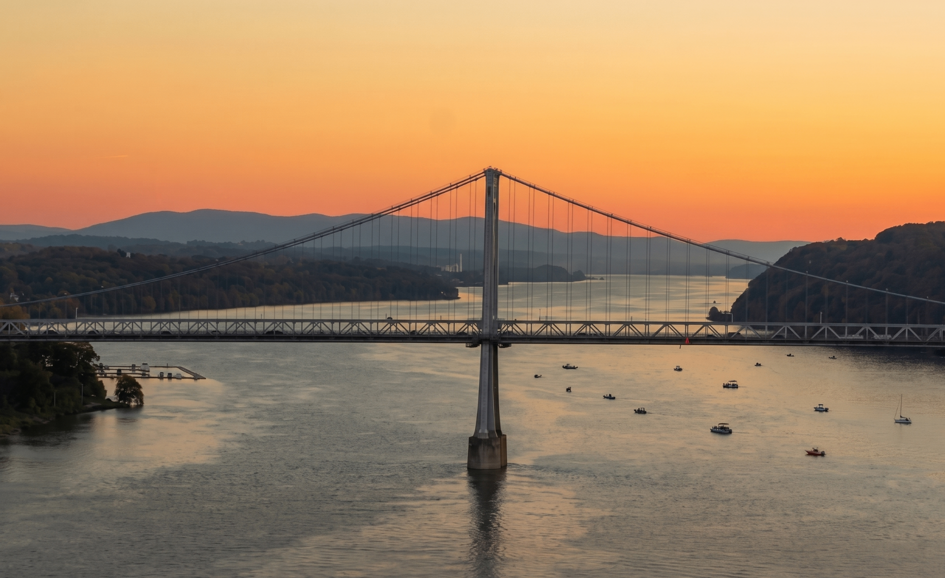 Mid-Hudson Bridge glowing at sunset over the Hudson River in Poughkeepsie — Hudson Valley digital marketing and local SEO service area